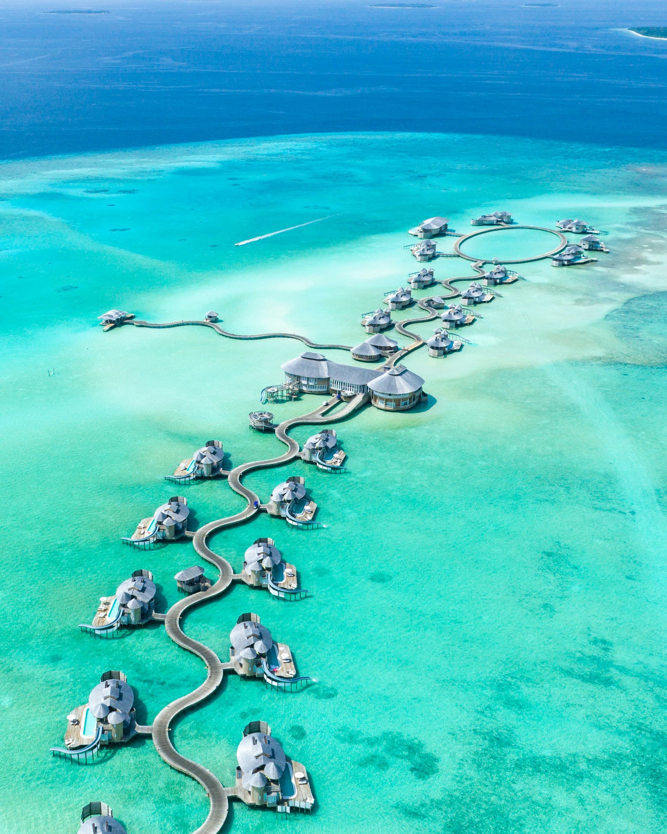 An island surrounded by turquoise water in the Maldives