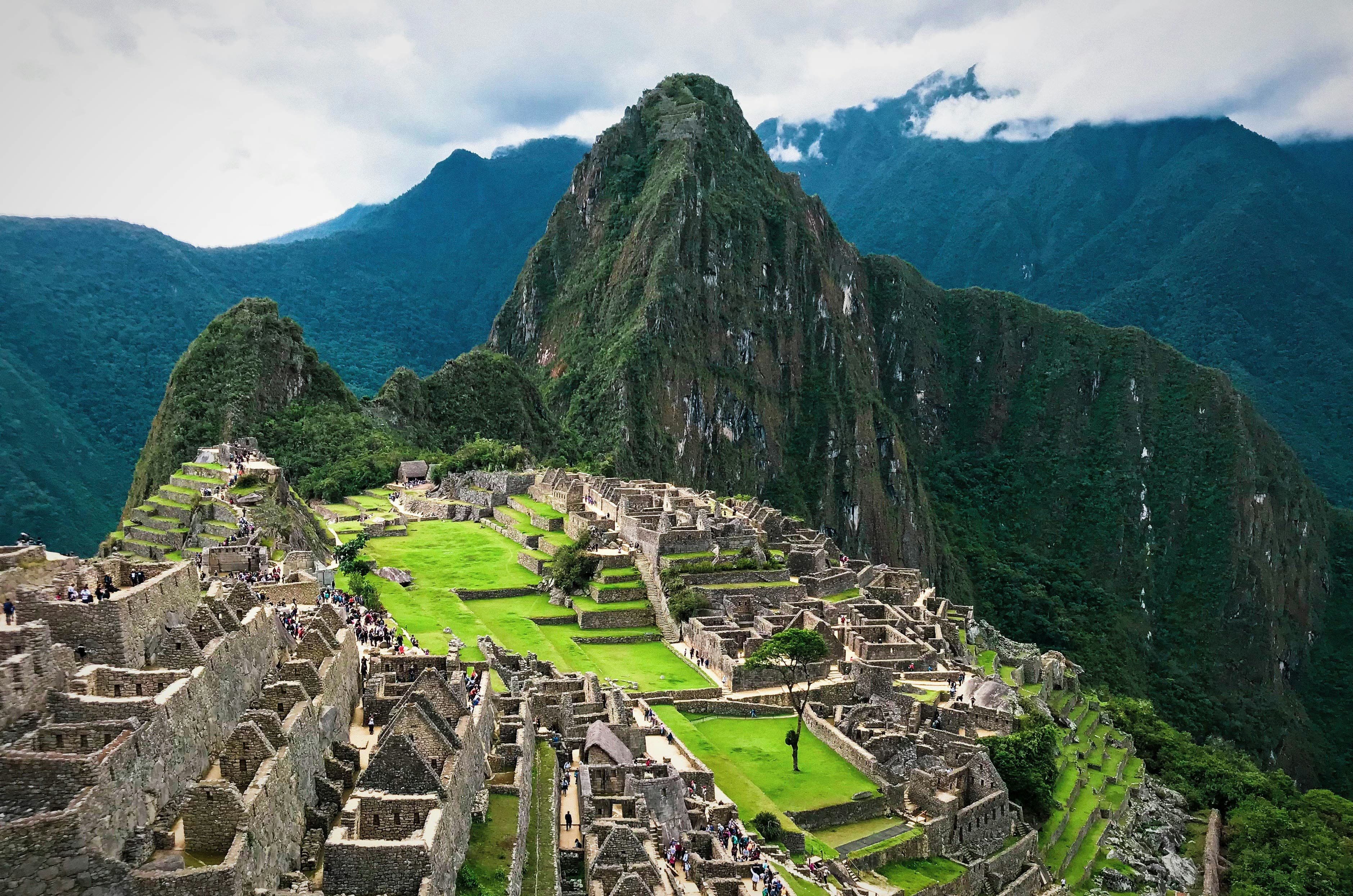 Machu Picchu surrounded by mountains and clouds
